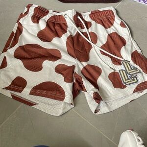 Brown cow print Lumber Legs shorts!